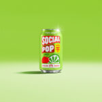 A can of Social Pop Cherry Limeade sitting in a green room