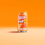 A can of Social Pop Orange Cream sitting in an orange room
