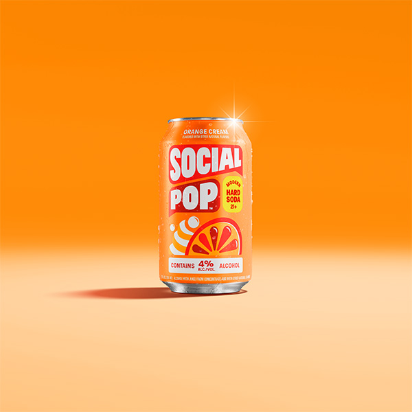 A can of Social Pop Orange Cream sitting in an orange room