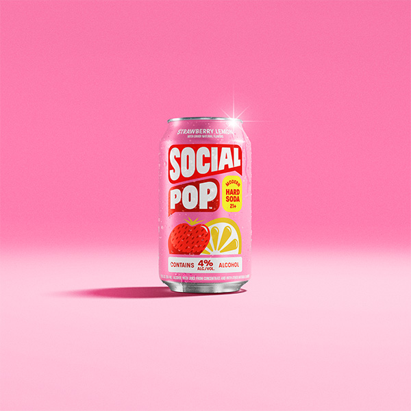 A can of Social Pop Strawberry Lemon sitting in a pink room
