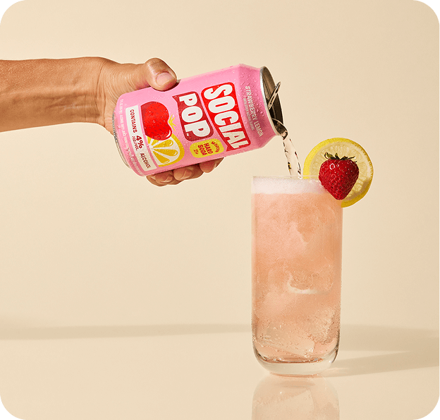 Strawberry Lemon Hard Soda being poured from a can into a glass